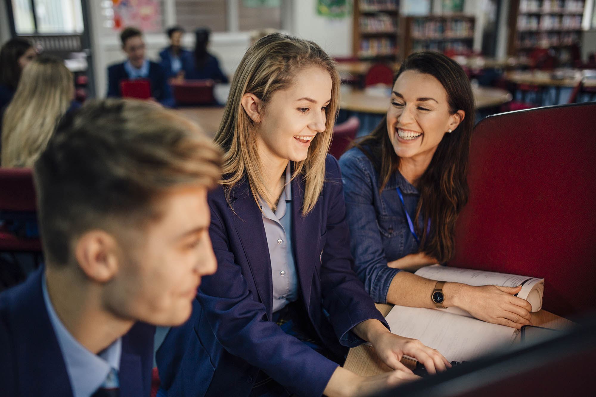 Girls smiling and laughing in classroom